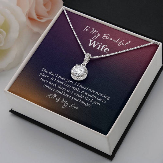 To my beautiful wife message card with a diamond halo white gold necklace and roses next to it