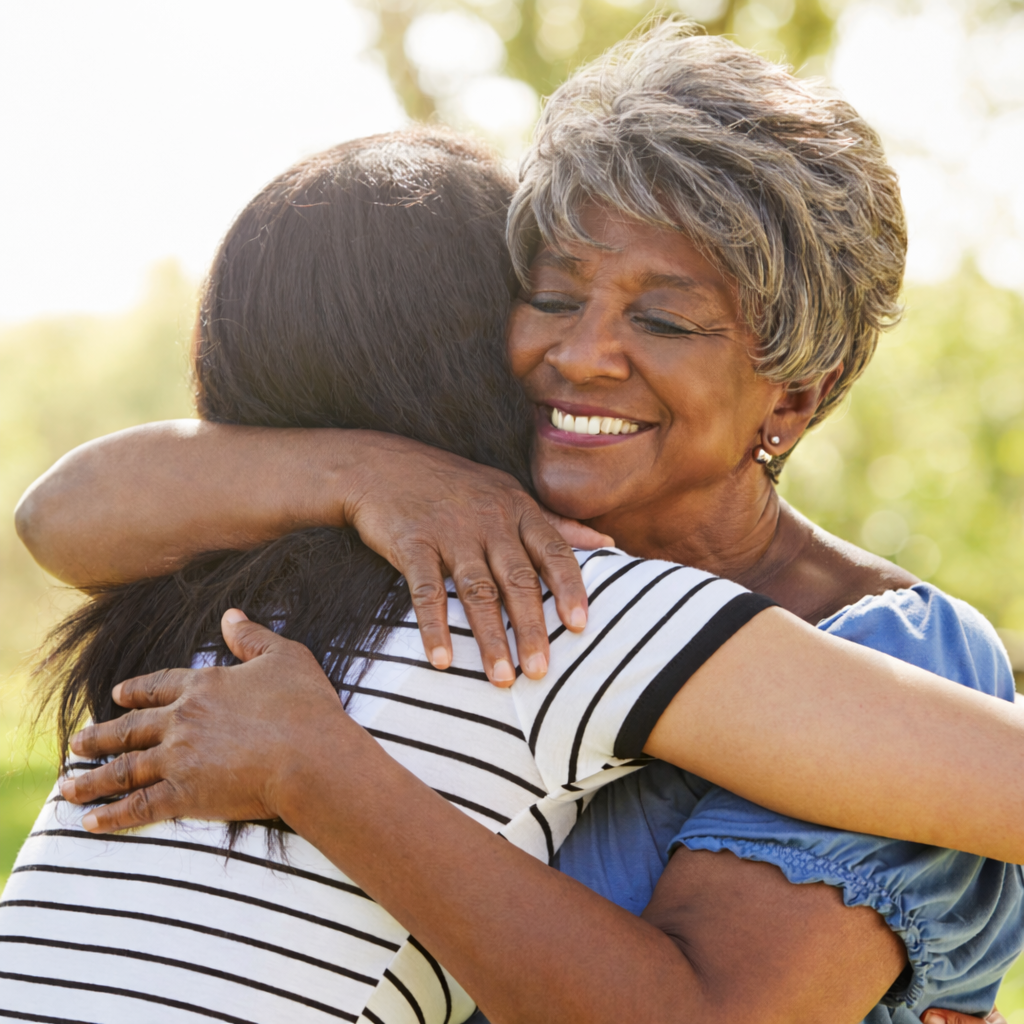Grandmother and granddaughter hugging