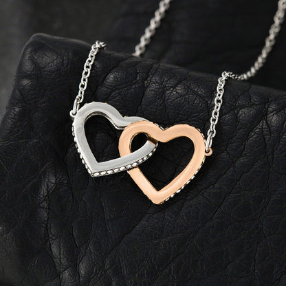 a rose and white gold linked hearts necklace close up
