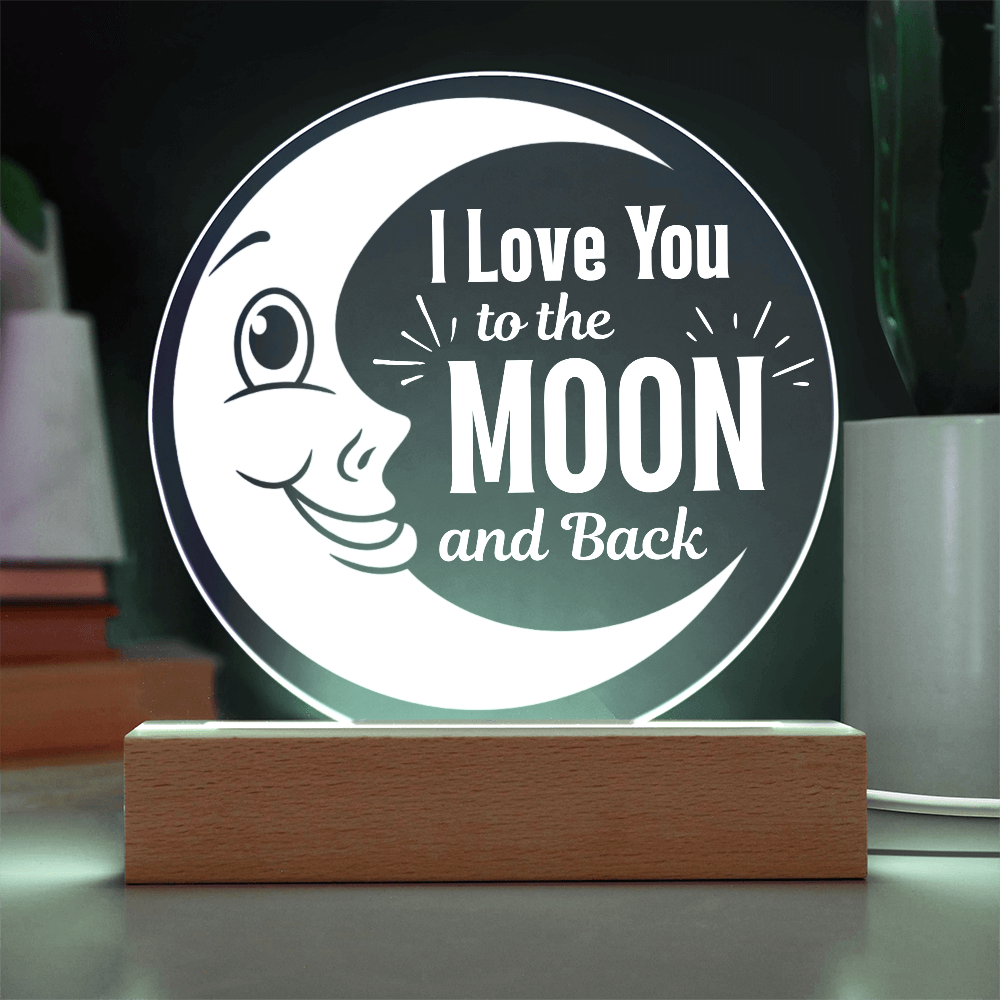 I love you to the moon and back light up plaque with cord on table