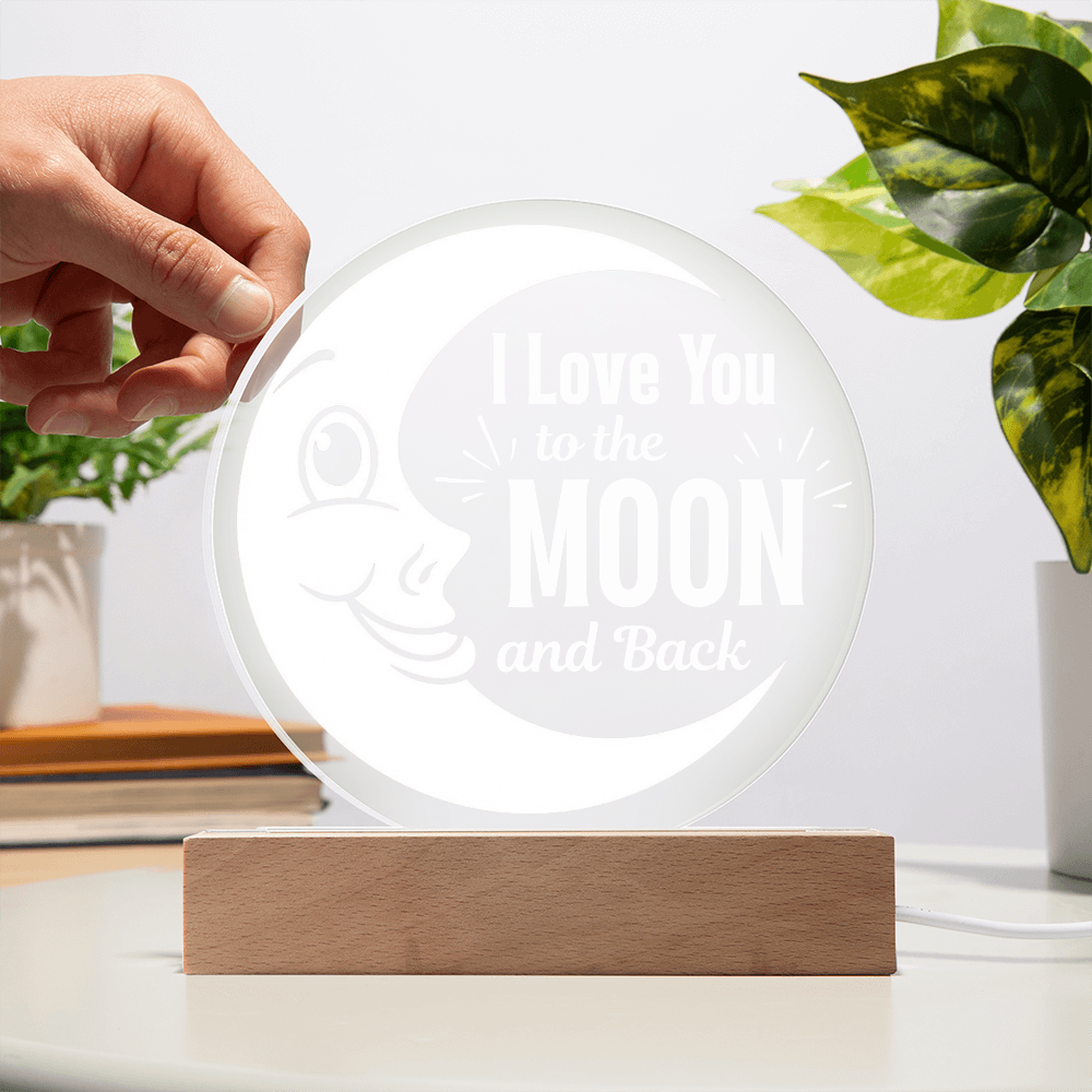 I love you to the moon and back plaque with hand showing transparency against a white wall
